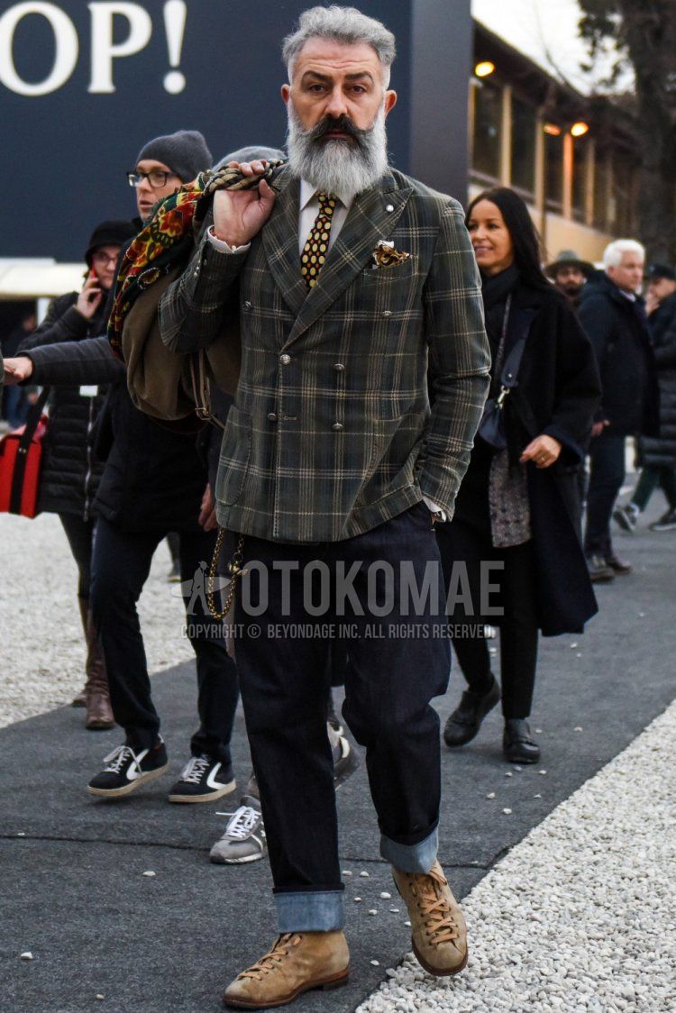 Winter men's coordination and outfit with gray checked tailored jacket, plain white shirt, plain navy denim/jeans, and brown boots.