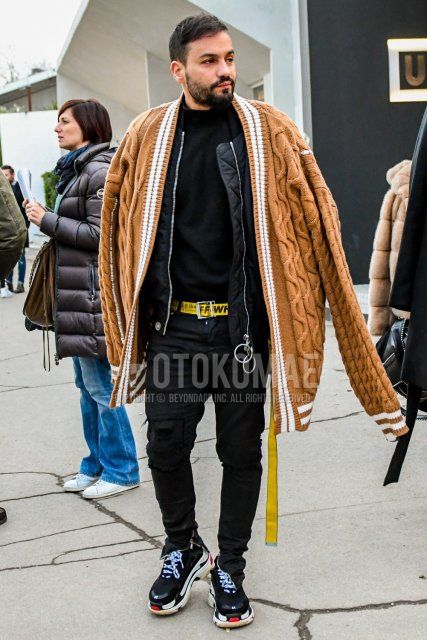 Winter men's coordinate and outfit with plain black MA-1, plain black turtleneck knit, yellow graphic tape belt, plain black damaged jeans, and Balenciaga black low-cut sneakers.