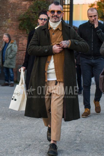 Men's fall/winter outfit with solid beige sunglasses, solid gray stainless steel collar coat, solid beige shirt jacket, solid white turtleneck knit, solid beige slacks, solid beige chinos, and black/olive green leather shoes.