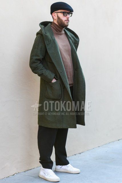 Men's fall/winter outfit and outfit with solid black hunting cap, solid black sunglasses, solid olive green hooded coat, solid beige turtleneck knit, solid gray slacks, and white low-cut sneakers.