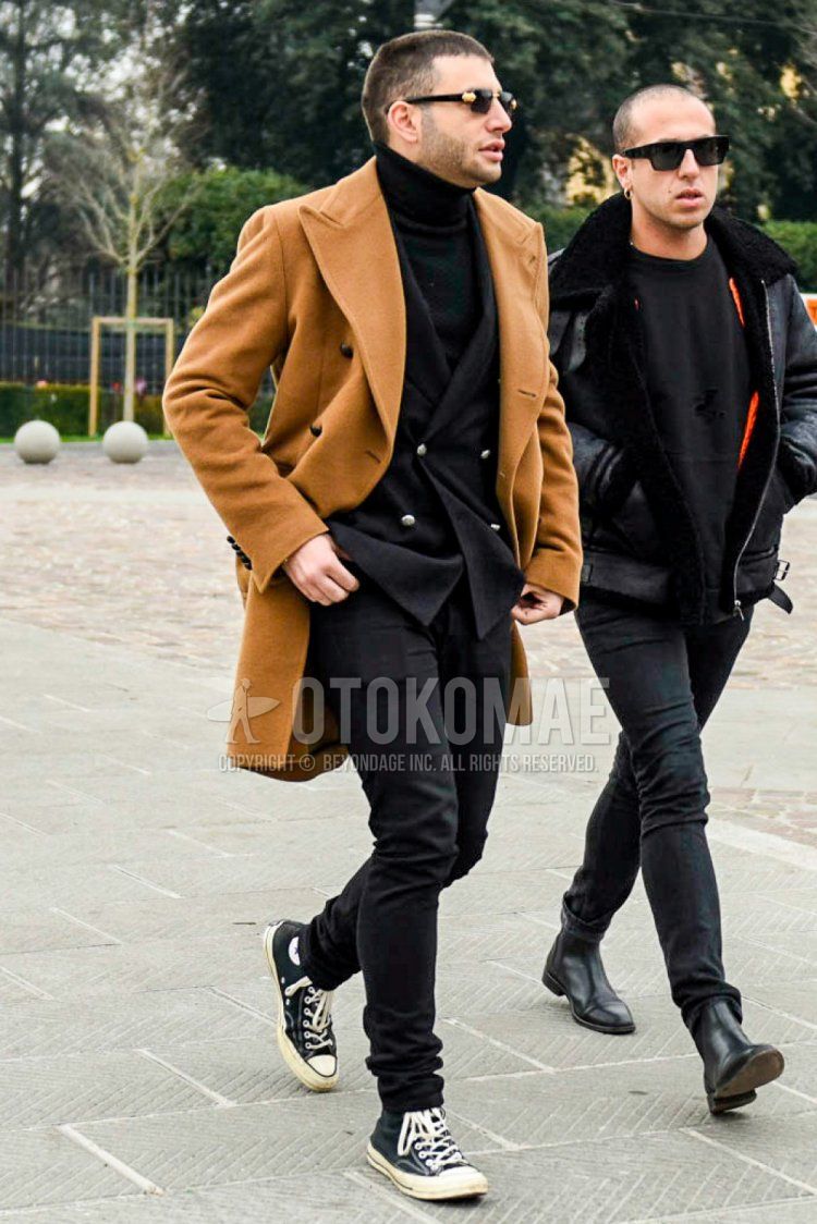 Men's fall/winter coordinate and outfit with plain black sunglasses, plain beige chester coat, plain black turtleneck knit, plain black tailored jacket, plain black denim/jeans, and Converse All Star black high-cut sneakers.