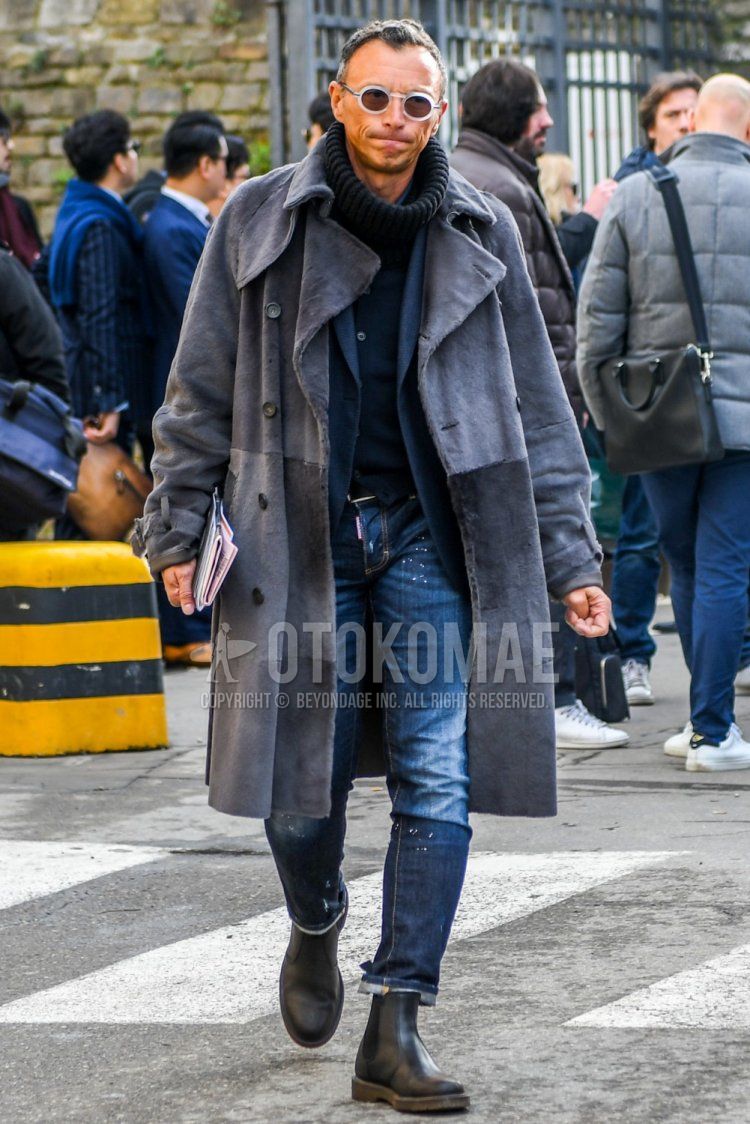 Winter men's coordinate and outfit with clear solid sunglasses, solid black snood, solid gray trench coat, solid navy tailored jacket, solid navy cardigan, solid navy denim/jeans from Dsquared, and black side gore boots.