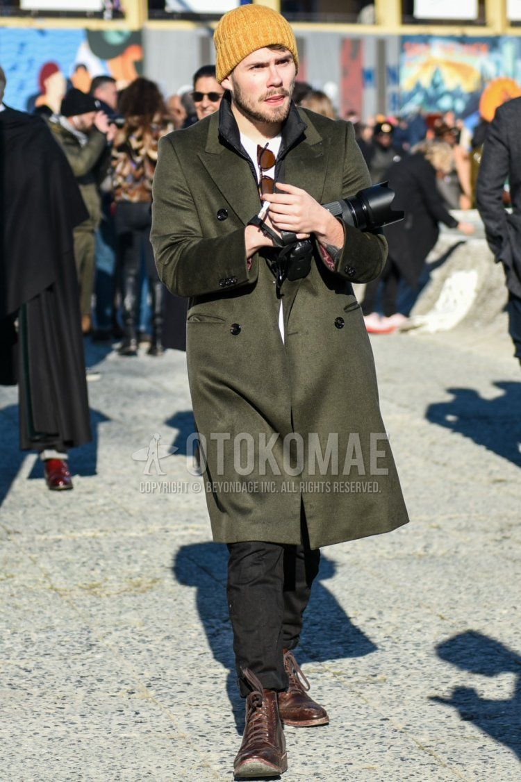 Men's fall/winter coordinate and outfit with plain yellow knit cap, plain olive green chester coat, plain black inner down, plain white t-shirt, plain black denim/jeans, and brown boots.