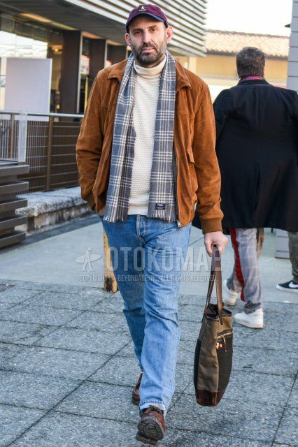 Red one-pointed baseball cap, gray checked scarf/stall, solid brown shirt jacket, solid white turtleneck knit, solid light blue denim/jeans, solid brown U-tip leather shoes, solid beige briefcase/handbag for fall/winter Men's Codes and Outfits.