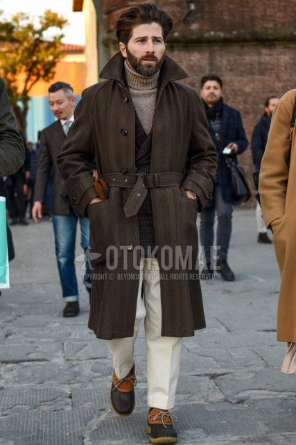 Men's fall/winter outfit with plain brown trench coat, brown checked tailored jacket, plain beige turtleneck knit, plain white slacks, plain brown socks, and beige/brown low-cut sneakers.