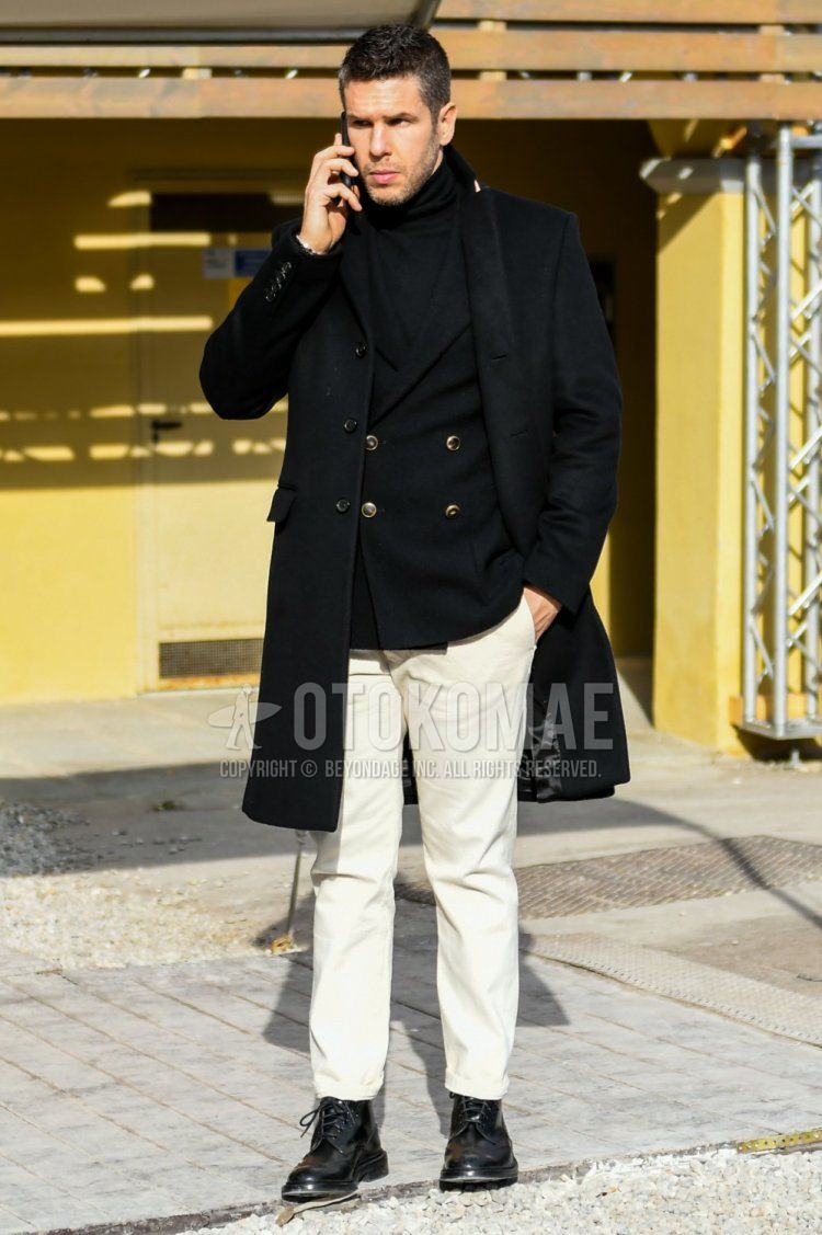 Winter men's coordinate and outfit with plain black chester coat, plain black tailored jacket, plain black turtleneck knit, plain white cotton pants, and black boots.