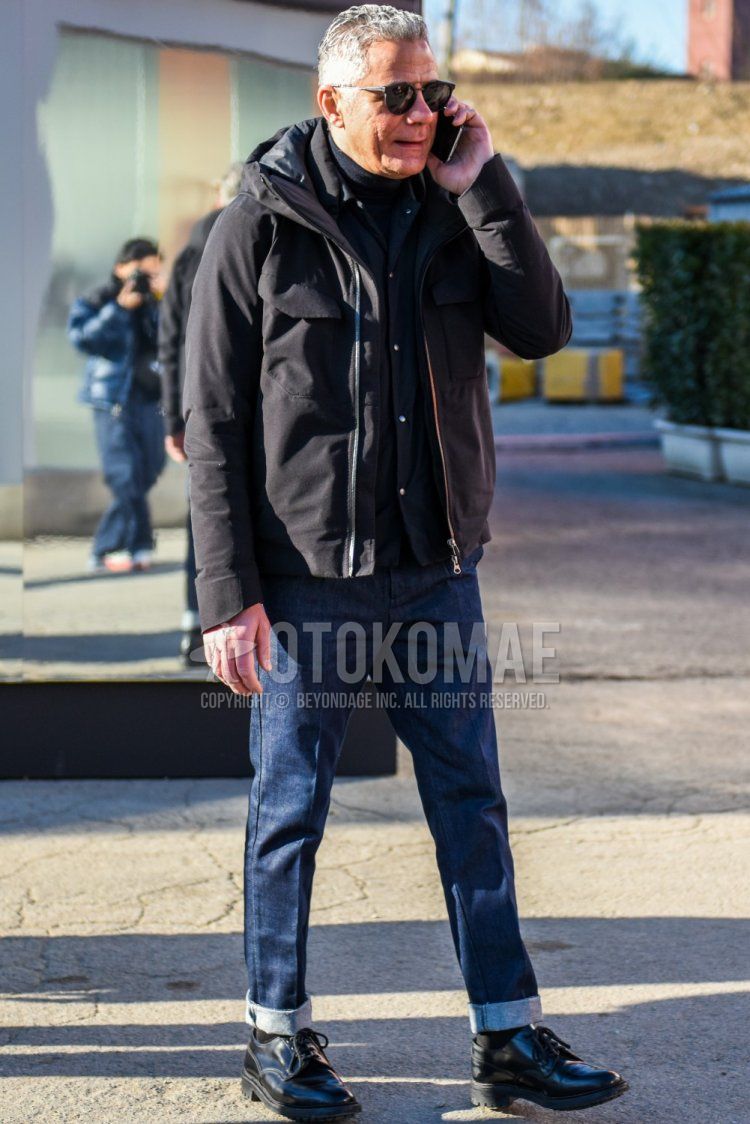 Winter men's coordinate and outfit with solid color sunglasses, solid color black down jacket, solid color black coach jacket, solid color black turtleneck knit, solid color navy denisla, solid color black socks and black plain toe leather shoes.