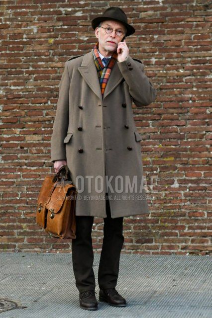 Solid brown hat, solid black glasses, multi-colored checked scarf/stall, solid beige chester coat, white/blue striped shirt, solid brown slacks, brown U-tip leather shoes, solid brown briefcase/handbag, solid navy tie. Winter men's coordinate/outfit with.