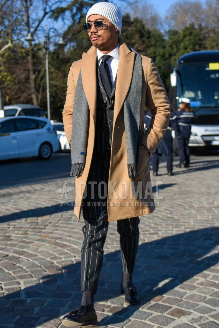 Men's fall/winter coordinate and outfit with plain white knit cap, plain gray scarf/stall, plain beige chester coat, plain white shirt, dark gray plain socks, black tassel loafer leather shoes, dark gray striped suit, dark gray plain tie.