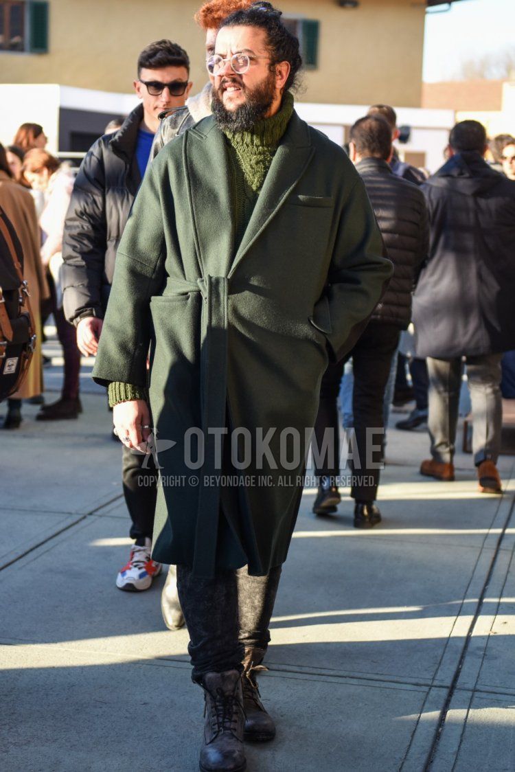 Men's fall/winter coordinate and outfit with clear solid color glasses, olive green solid color chester coat, olive green solid color belted coat, olive green solid color turtleneck knit, gray bottom slacks, brown work boots.
