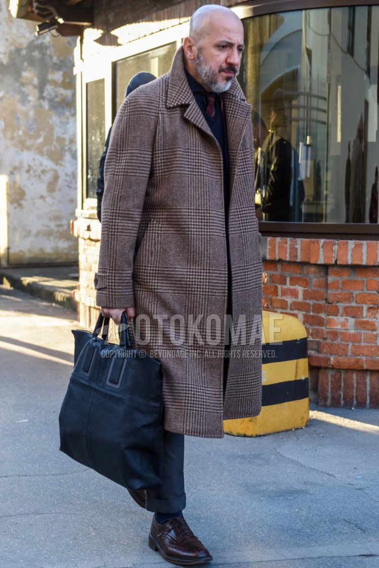 Fall/Winter with gray checked stainless coat, solid navy shirt, solid gray slacks, solid navy socks, brown wingtip leather shoes, brown brogue shoes leather shoes, dark gray solid briefcase/handbag, multicolor tie tie Men's Codes and Outfits for.
