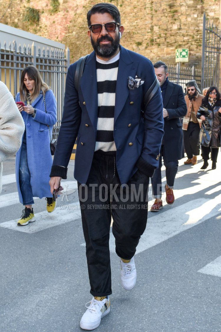 Spring and fall men's coordinate and outfit with Wellington plain black sunglasses, plain navy tailored jacket, white/black striped sweater, plain white t-shirt, plain gray easy pants, beige socks socks, and white low-cut sneakers.