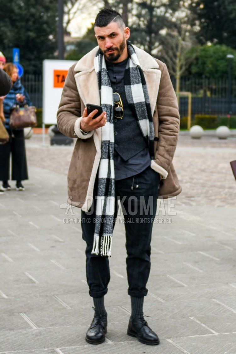 Winter men's coordinate and outfit with white/black border scarf/stall, plain brown leather jacket (not riders), plain dark gray shirt, plain dark gray gilet, black checked easy pants, plain dark gray socks, black brogue shoes leather shoes.