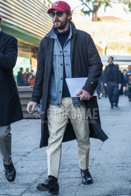 Red graphic baseball cap, solid black sunglasses, solid gray stainless steel collar coat, solid blue denim jacket, dark gray solid turtleneck knit, solid beige chinos, solid beige ankle pants, solid black socks, black plain toe leather shoes. Men's fall/winter outfits and outfits.