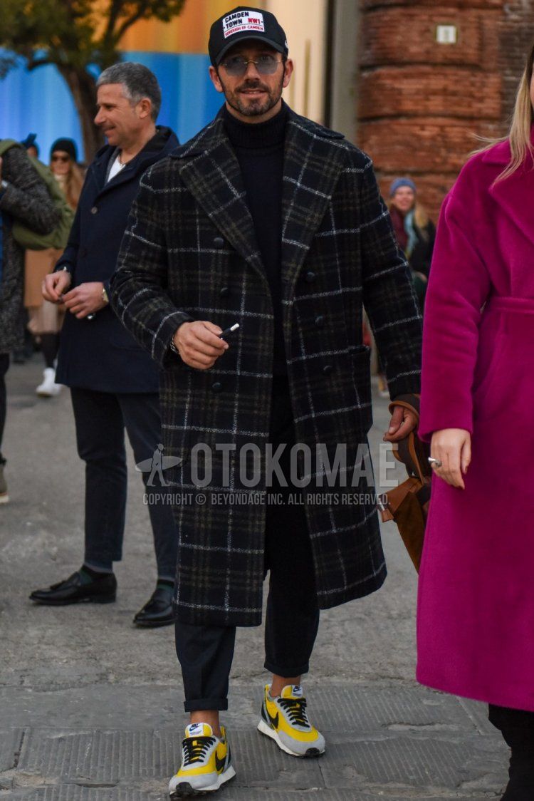 Men's fall/winter outfit with black baseball cap, plain silver sunglasses, dark gray check chester coat, plain black turtleneck knit, plain gray slacks, Nike Undercover Daybreak gray/yellow low-cut sneakers. Outfit.