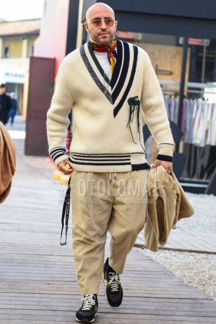 Beige-gold tortoiseshell sunglasses, bandana/neckerchief with multi-colored stole, solid white sweater, solid white turtleneck knit, solid beige winter pants (corduroy, velour), solid beige ankle pants, Nike Undercover Daybreak black low cut Men's fall/winter coordinate and outfit with sneakers.