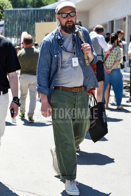 Men's spring and summer coordinate and outfit with plain gray cap, plain black sunglasses, plain gray shirt, plain gray t-shirt, plain brown leather belt, plain olive green chinos, and white high-cut sneakers.
