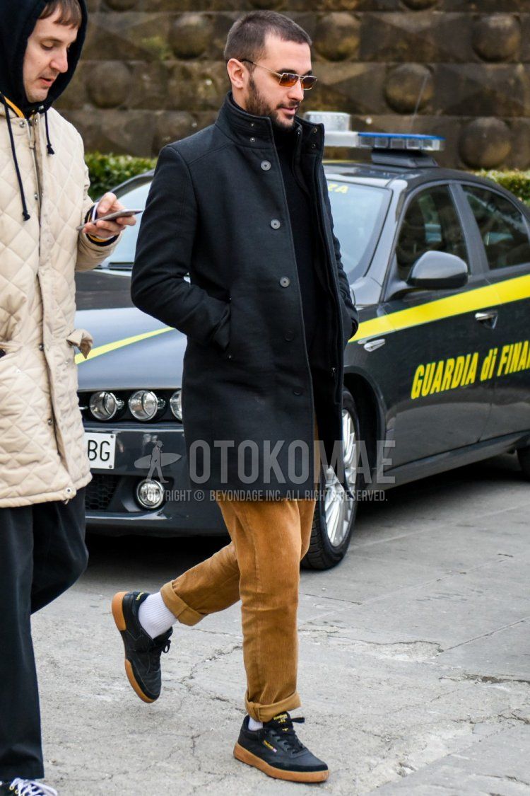 Men's fall/winter coordinate and outfit with solid color sunglasses, solid color gray outerwear, solid color black turtleneck knit, solid color beige winter pants (corduroy,velour), solid color white socks, and black low-cut Reebok sneakers.