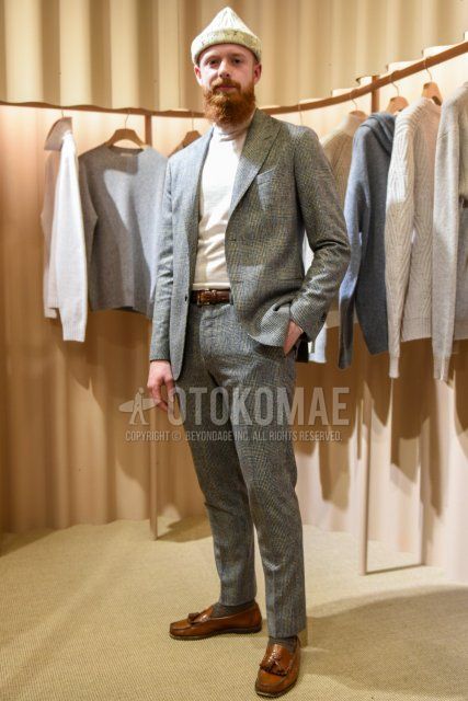 Men's spring and fall coordinate and outfit with plain white knit cap, plain white turtleneck knit, plain brown leather belt, brown tassel loafer leather shoes, and gray checked suit.