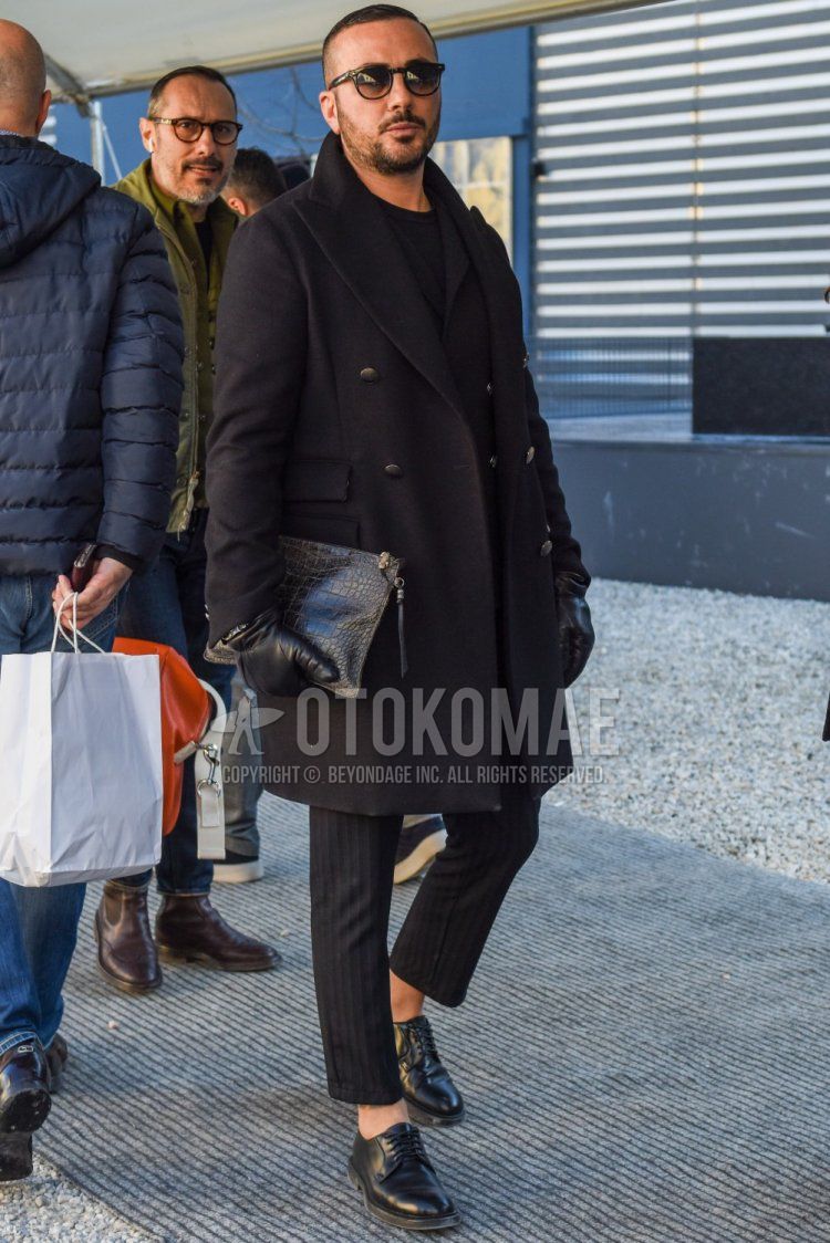Solid black sunglasses, solid black chester coat, solid black tailored jacket, solid black sweater, gray striped slacks, gray striped ankle pants, black plain toe leather shoes, solid black clutch bag/second bag/drawl for men in fall/winter. Outfit.