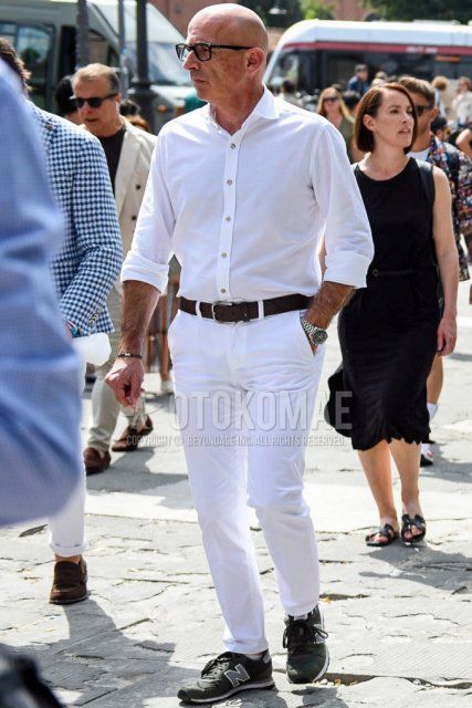 Men's spring/summer coordinate and outfit with plain black glasses, plain white shirt, plain brown leather belt, plain white cotton pants, and New Balance black low-cut sneakers.