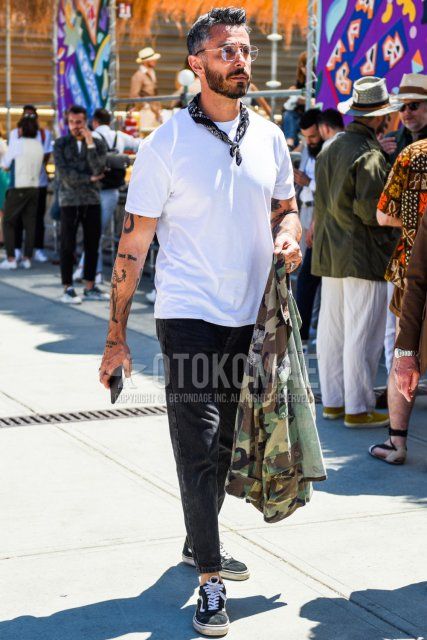 Summer men's coordinate and outfit with plain silver glasses, black stole bandana/neckerchief, plain white t-shirt, plain dark gray denim/jeans, and Vans Old School black low-cut sneakers.