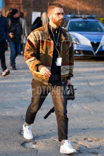 Men's fall/winter coordinate and outfit with brown tortoiseshell glasses, Pendleton multi-colored outerwear, solid black cardigan, solid gray denim/jeans, solid gray ankle pants, gray socks socks, Reebok white low-cut sneakers.