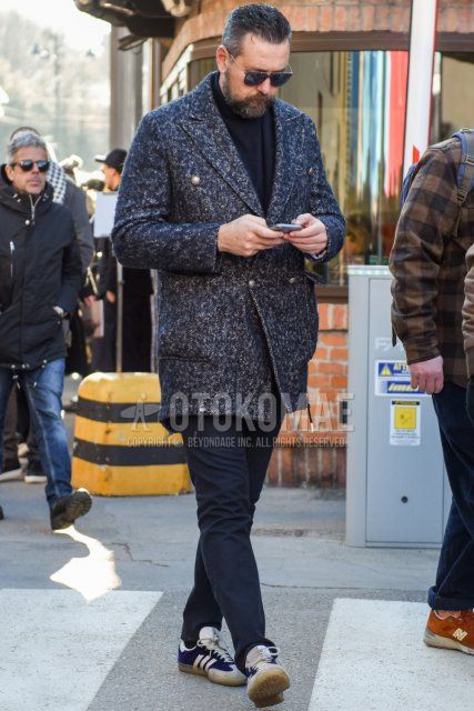 Winter men's coordinate and outfit with gold-black solid sunglasses, navy herringbone chester coat, navy solid turtleneck knit, black solid slacks, navy solid socks, and Adidas purple low-cut sneakers.
