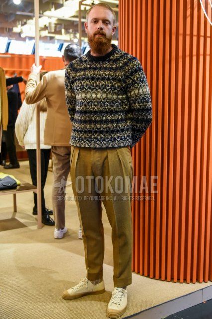 Men's spring/autumn coordinate and outfit with multi-colored top/inner sweater, solid beige slacks, solid beige pleated pants, solid beige ankle pants, solid beige socks, and white low-cut sneakers.