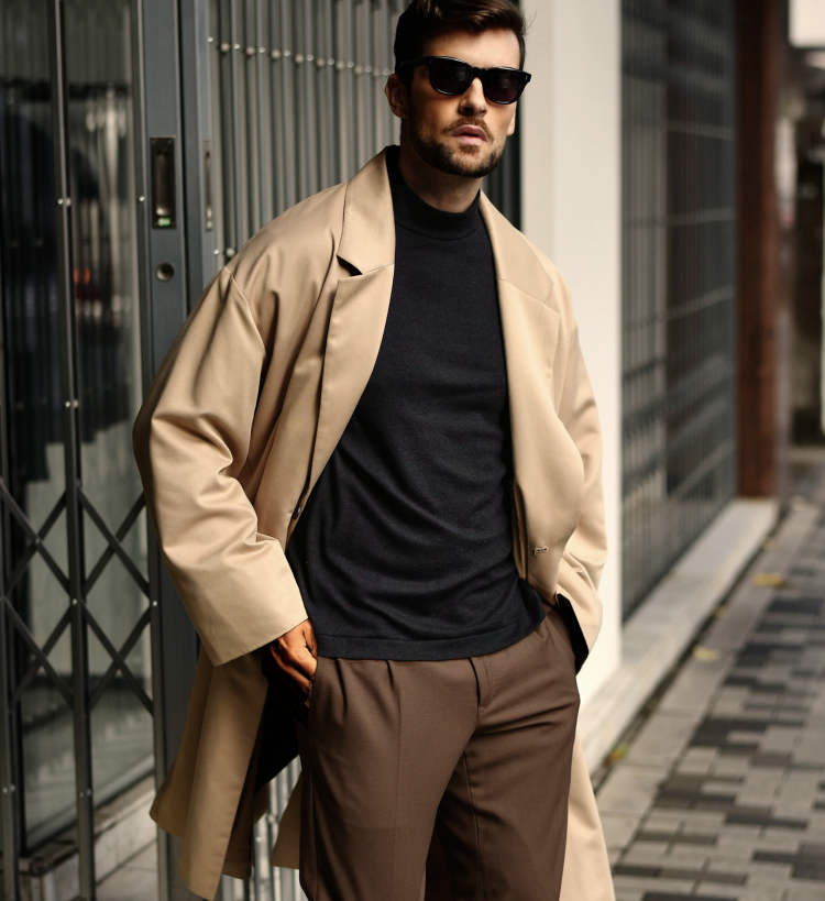 Men's spring coordinate using knitwear is a mock neck knit and beige coat