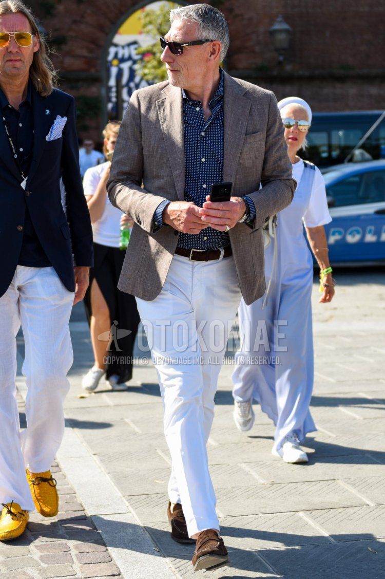 Men's spring, summer, and fall coordinate and outfit with plain black sunglasses, plain brown tailored jacket, plain navy shirt, plain brown leather belt, plain white cotton pants, and suede brown coin loafer leather shoes.
