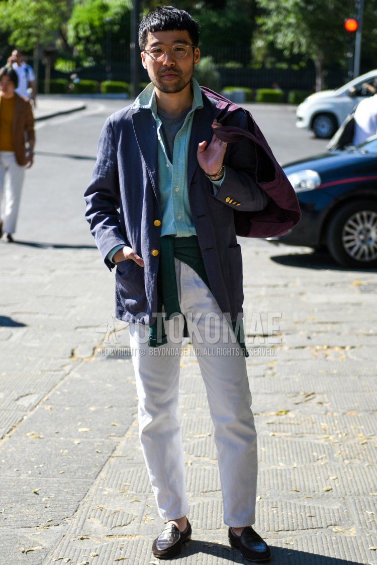 Men's spring, summer, and fall coordinate and outfit with plain silver glasses, plain navy tailored jacket, plain light blue shirt, plain gray T-shirt, plain white cotton pants, and brown coin loafer leather shoes.