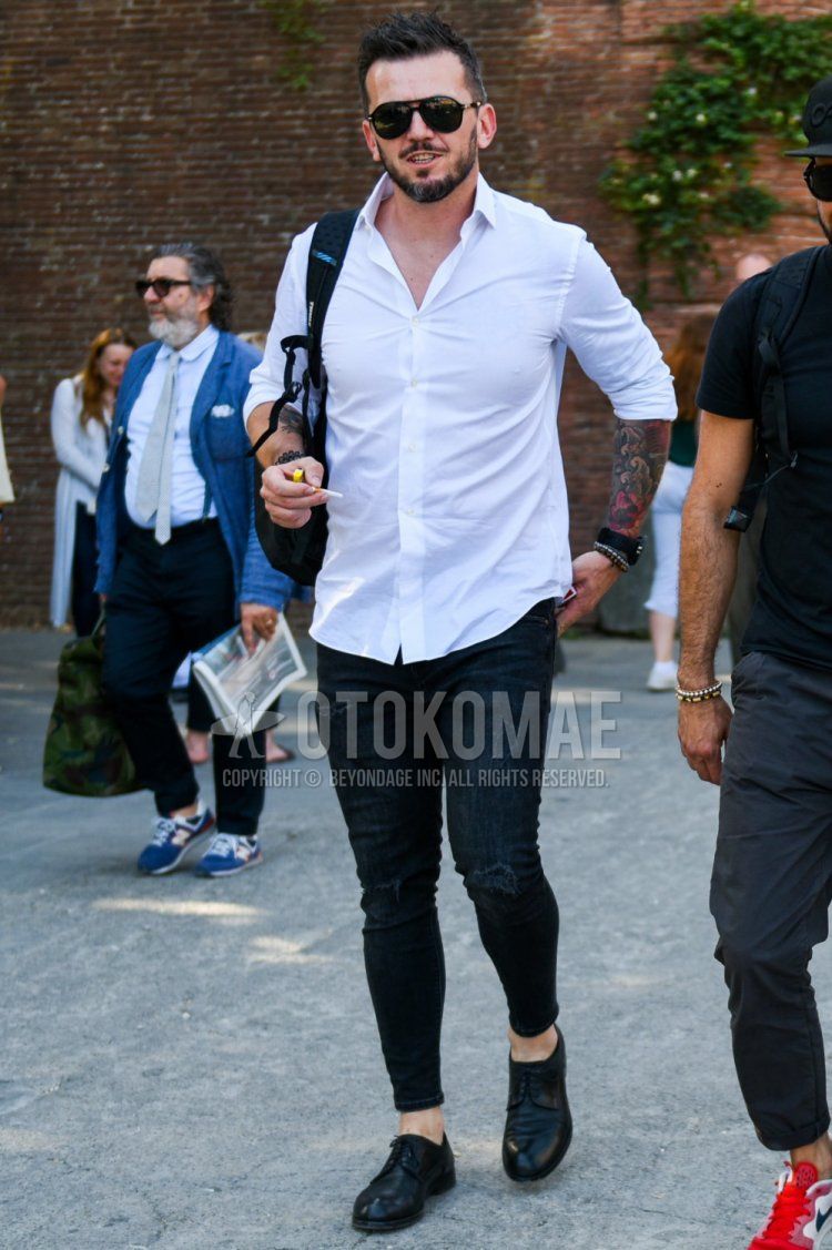 Men's spring/summer/autumn coordination and outfit with plain black sunglasses, plain white shirt, plain black denim/jeans, and black plain toe leather shoes.