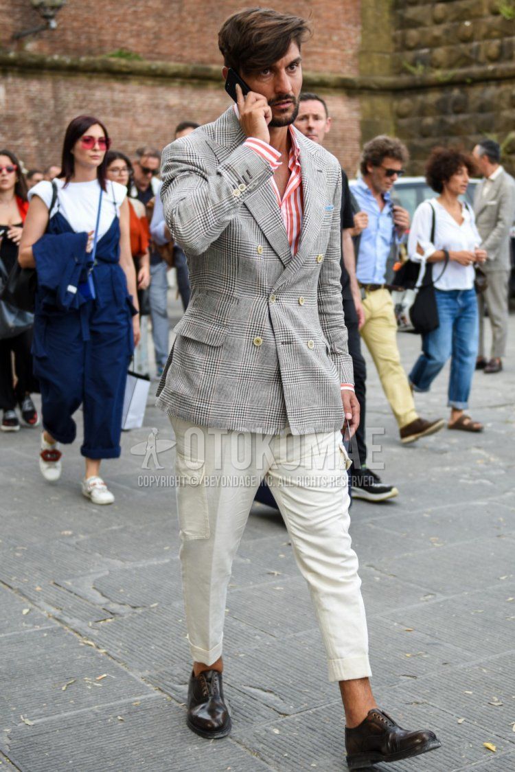 Men's spring, summer, and fall coordination and outfit with gray checked tailored jacket, red and white striped shirt, plain white cargo pants, and brown straight-tip leather shoes.