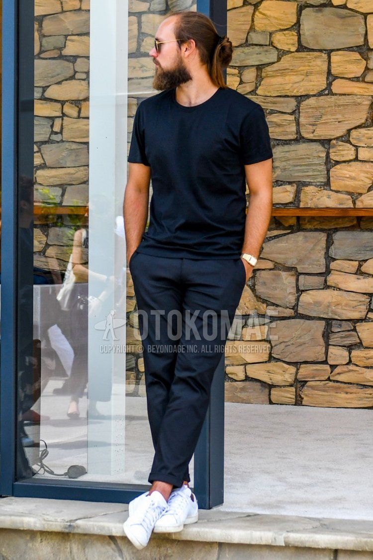 Men's summer coordinate and outfit with plain sunglasses, plain navy t-shirt, plain gray slacks, and white low-cut sneakers.