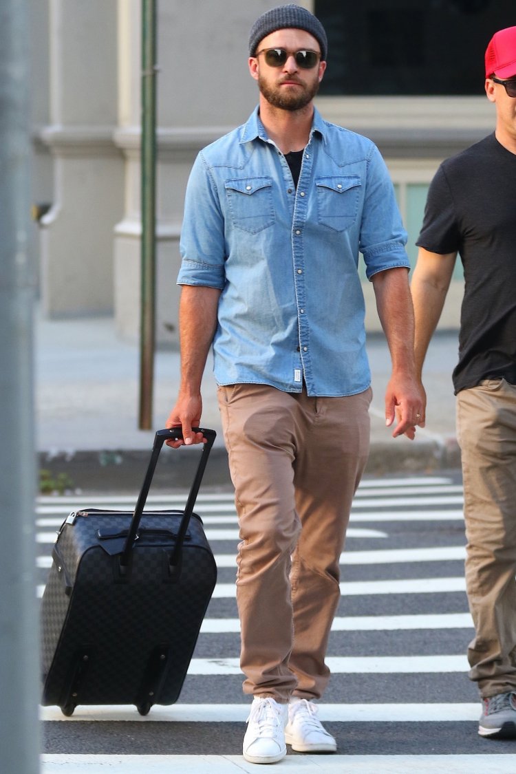 Justin Timberlake drags some luggage through the streets of New York