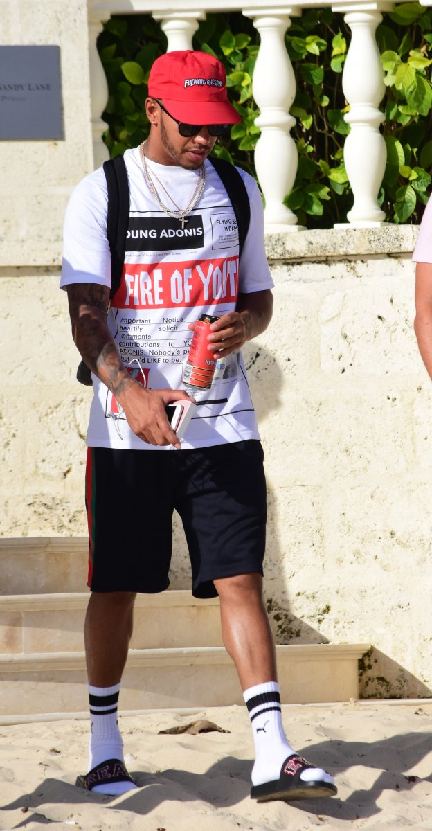 EXCLUSIVE: Lewis Hamilton lives up to his playboy image as he continues his partying in Barbados