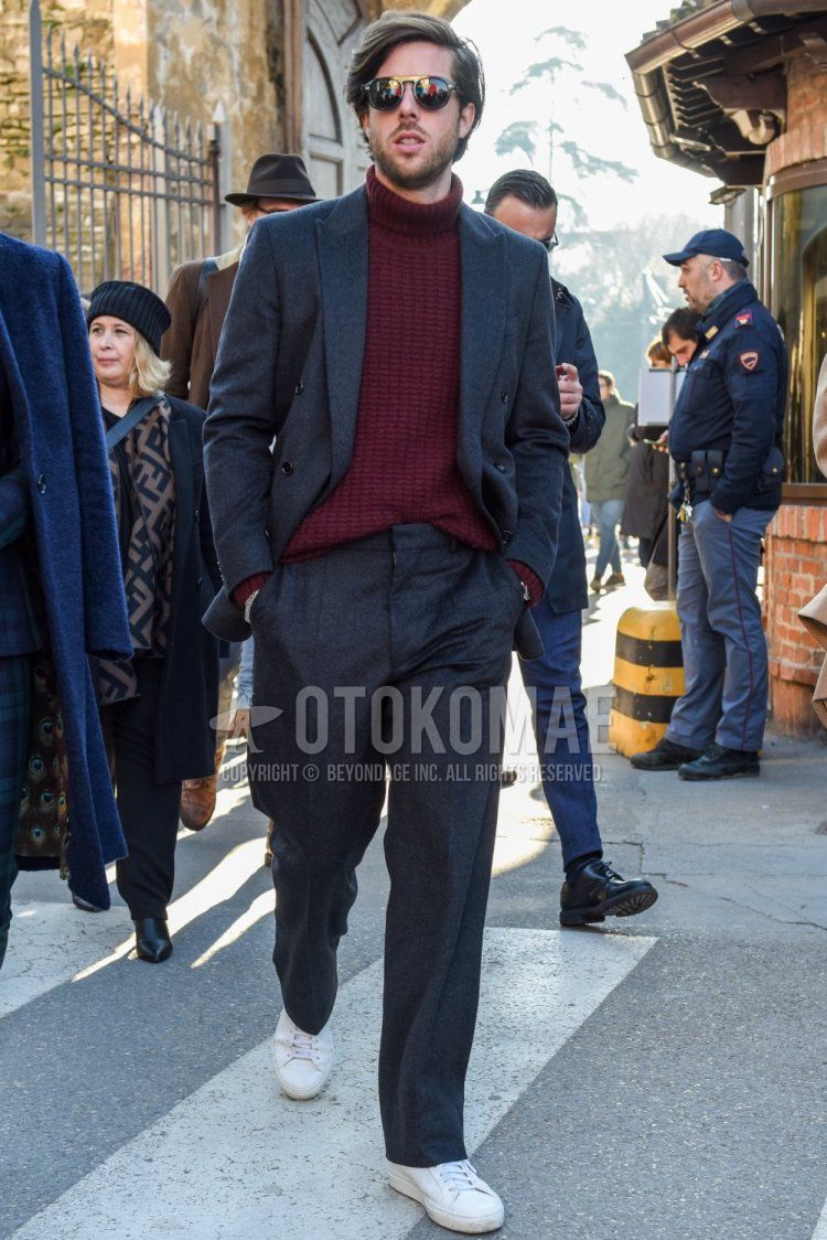 Men's fall/spring outfit and outfit with plain black sunglasses, plain red turtleneck knit, white low-cut sneakers, and plain gray suit.