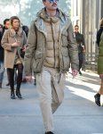 Winter men's coordinate and outfit with solid gold sunglasses, solid beige field jacket/hunting jacket, solid beige inner down, solid beige chinos, and New Balance gray low-cut sneakers.