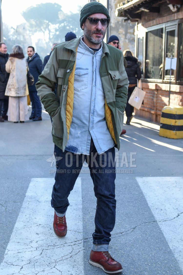 Men's fall/winter coordinate and outfit with solid gray knit cap, solid olive green/green shirt jacket, solid light blue denim/chambray shirt with band collar, solid navy denim/jeans, and brown work boots.