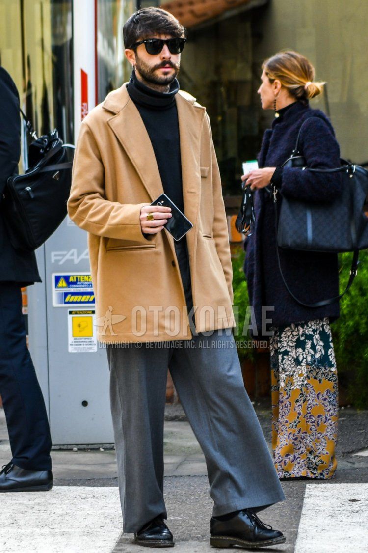 Men's spring and fall outfit and outfit with solid color sunglasses, solid color beige outerwear, solid color black turtleneck knit, solid color gray slacks, and Dr. Martens black plain toe leather shoes.