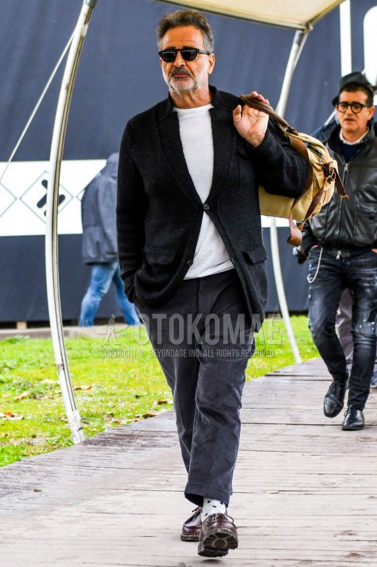 Men's winter coordinate and outfit with plain sunglasses, plain black tailored jacket, plain white t-shirt, dark gray plain winter pants (corduroy,velour), white dotted socks, brown leather shoes.