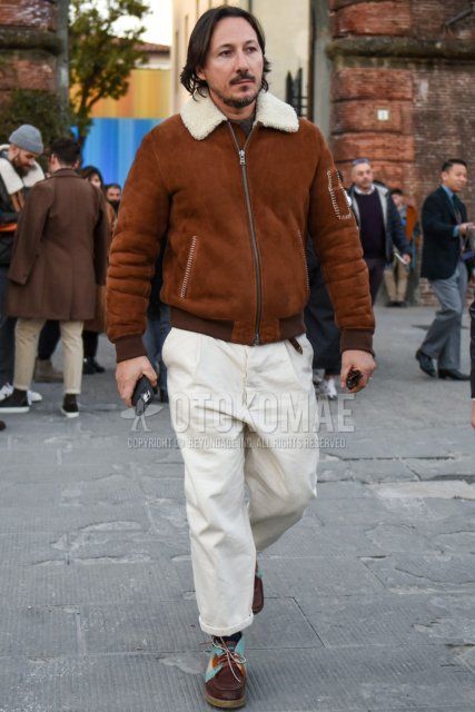 Men's fall/winter outfit with plain brown leather jacket (not riders), plain white slacks, plain white pleated pants, and brown leather shoes.