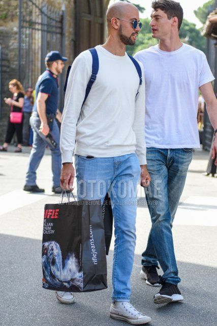 Men's spring/autumn coordinate/outfit with plain silver sunglasses, plain white trainers, plain light blue denim/jeans, and white high-cut Converse sneakers.