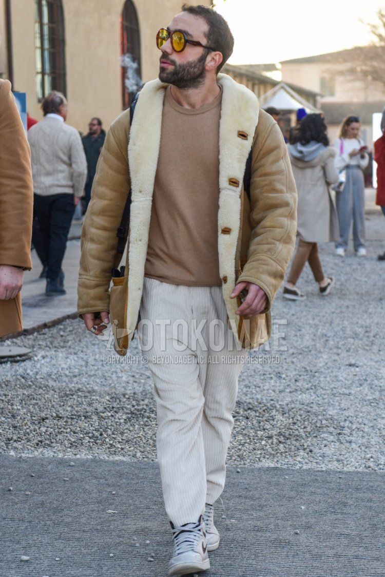 Men's fall/winter coordinate and outfit with brown tortoiseshell sunglasses, plain beige leather jacket (except riders), plain beige sweater, plain white winter pants (corduroy,velour), and Nike gray high-cut sneakers.