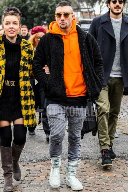 Men's fall/winter coordinate and outfit with solid color sunglasses, solid color black fleece jacket, solid color orange hoodie, solid color black t-shirt, solid color gray cotton pants, and gray high-cut sneakers.