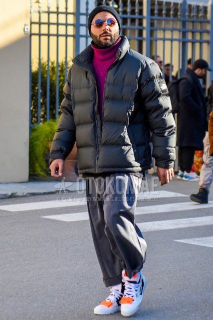 Winter men's coordinate and outfit with solid black knit cap, solid silver sunglasses, The North Face solid black down jacket, solid purple turtleneck knit, solid gray wide-leg pants, and off-white white low-cut sneakers.