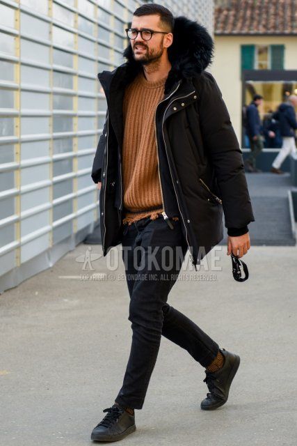 Winter men's coordinate and outfit with plain black down jacket, plain black cardigan, plain brown sweater, plain black cotton pants, plain brown socks, and black low-cut sneakers.
