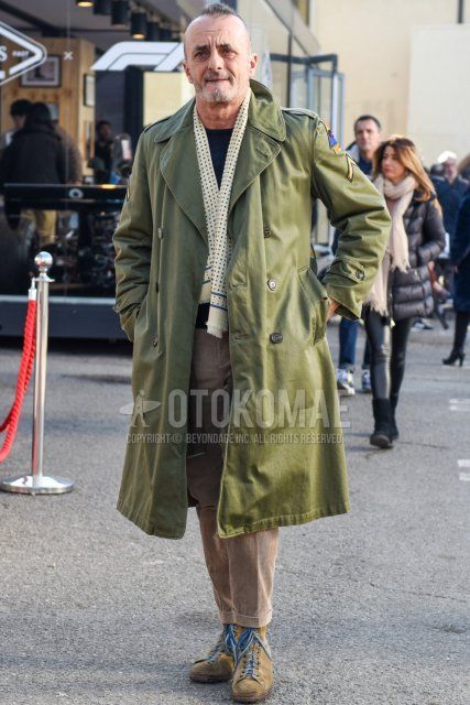 Men's fall/winter coordinate and outfit with beige dot scarf, olive green solid trench coat, solid black sweater, solid beige winter pants (corduroy,velour), solid beige cropped pants, beige high cut sneakers.