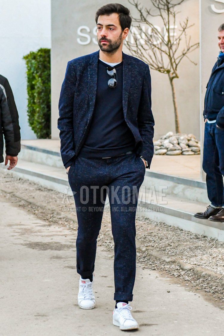 Men's winter coordinate and outfit with plain sweater, plain navy socks, Adidas white low-cut sneakers, and plain navy suit.